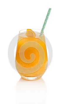 Fresh orange juice with slice of orange and straw