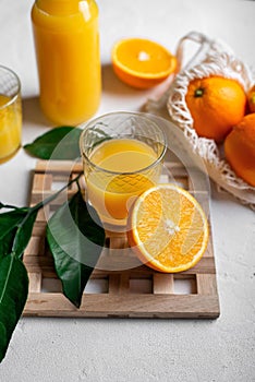 Fresh orange juice on a white table
