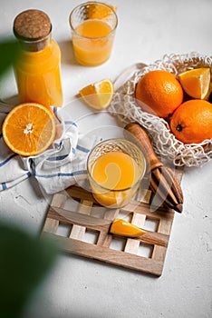 Fresh orange juice on a white table