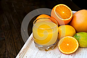 Fresh orange juice on wooden table