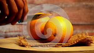 Fresh Orange and knife on table,two orange pics,tangerine rich with vitamins