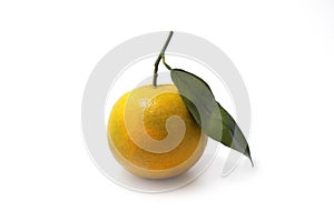 A fresh orange with a leaf
