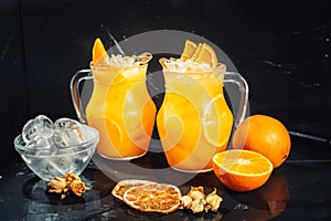 Fresh orange lemonade with ice and black