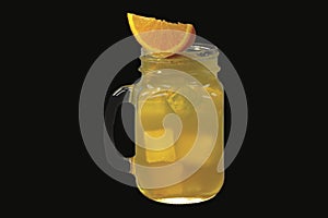 Fresh orange lemonade with ice cubes in vintage glass
