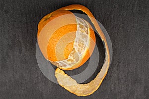 Fresh orange mandarin on grey stone