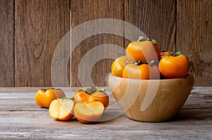 Fresh orange organic ripe Fuyu Persimmons or Persimon fruits