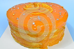 Fresh orange pound cake with fresh orange slices on top.