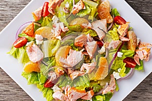 Fresh Orange Salmon salad with honey, tomatoes, onion, mandarin. healthy