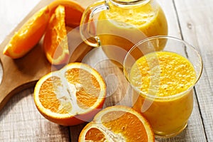 Fresh orange smoothie in glasses