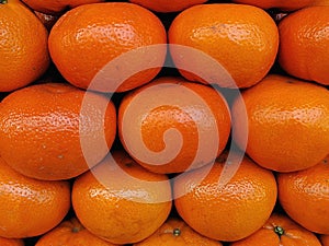 Fresh oranges display on the store, juicey healthy orangs fruits display close up view