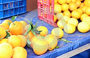 Fresh oranges at a greengrocers shop photo