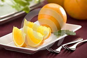 Fresh oranges on a plate