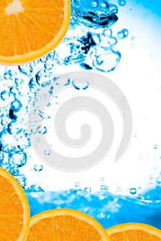 Fresh oranges and water