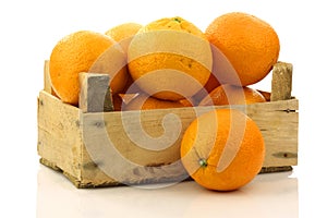 Fresh oranges in a wooden box