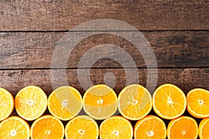 Fresh oranges on wooden table with copyspace