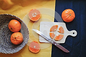 Fresh oranges on wooden table. Oranges in a bowl on wooden table