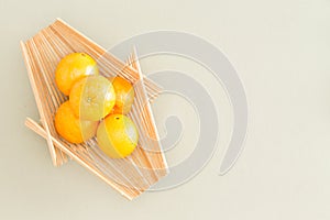 Fresh Oranges on Wooden Tray at the Table