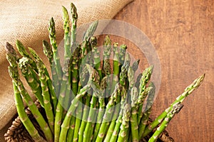Fresh organic Asparagus close up on wooden background