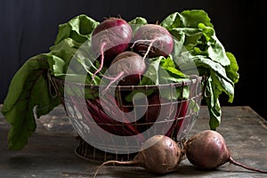 fresh organic beetroots in a wire basket