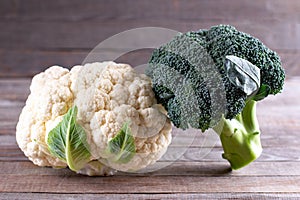 Fresh Organic cauliflower and broccoli on wooden table. Fresh vegetables