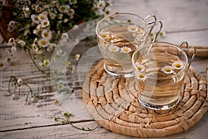Fresh organic chamomile tea with glass cups