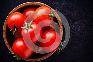 Fresh organic cherry tomatoes in a bowl closeup