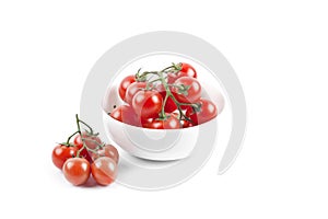 Fresh organic cherry tomatoes bunch on ceramic bowl