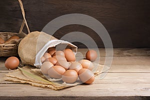 Fresh organic chicken eggs from the farm on a rustic wooden table