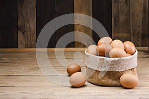 Fresh organic chicken eggs from the farm on a rustic wooden table