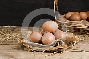 Fresh organic chicken eggs from the farm on a rustic wooden table