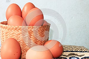 Fresh organic eggs and a blue background