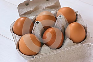 Fresh organic eggs in a carton