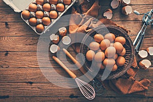 Fresh organic eggs with kitchen and baking utensils