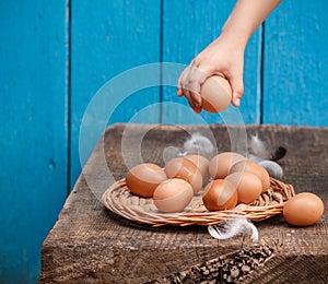 Fresh organic eggs on a wooden table. A rustic style