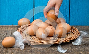 Fresh organic eggs on a wooden table. A rustic style