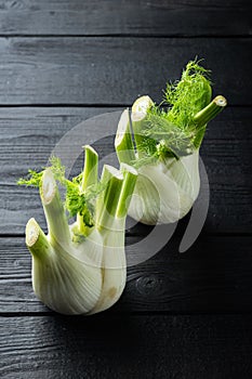 Fresh organic fennel, on black wooden table