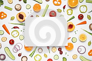 Fresh organic fruits, vegetables and blank card on white background, flat lay. Space for text