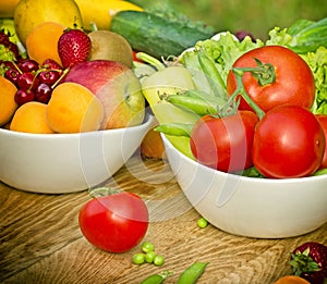 Fresh organic fruits and vegetables in bowls