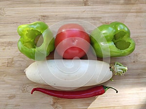Fresh organic fruits and vegetables on wooden background