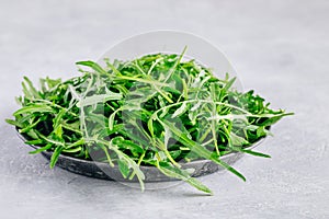 Fresh organic green leaves of arugula, ingredient for healthy salad