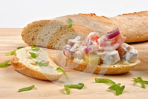 Fresh organic herring salad on bread