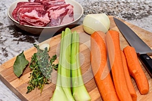 Fresh organic ingredients measured and chopped ready for making healthy family soups and strews for winter meals