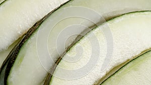 Fresh organic juicy white melon slices close up.