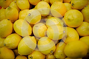 Fresh organic lemons on a market shelf