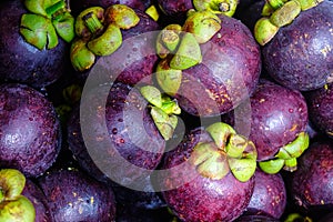 Fresh organic mangosteen fruits at the market