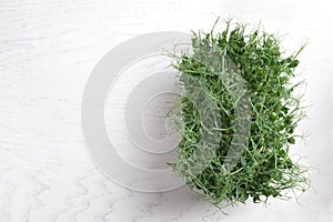 Fresh organic microgreen on white background, top view. Space for text