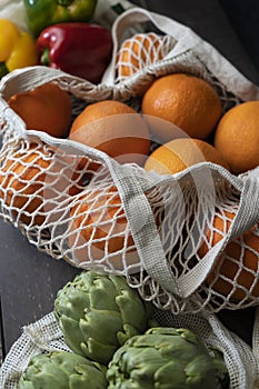 Fresh organic oranges and vegetables in eco reusable shopping bag.Plastic free and zero waste lifestyle.Healthy food in cotton