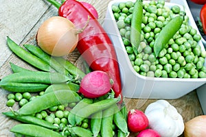 Fresh organic peas in bowl