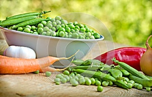 Fresh organic peas in bowl
