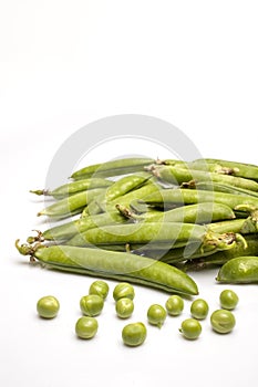 Fresh organic peas isolated on white background